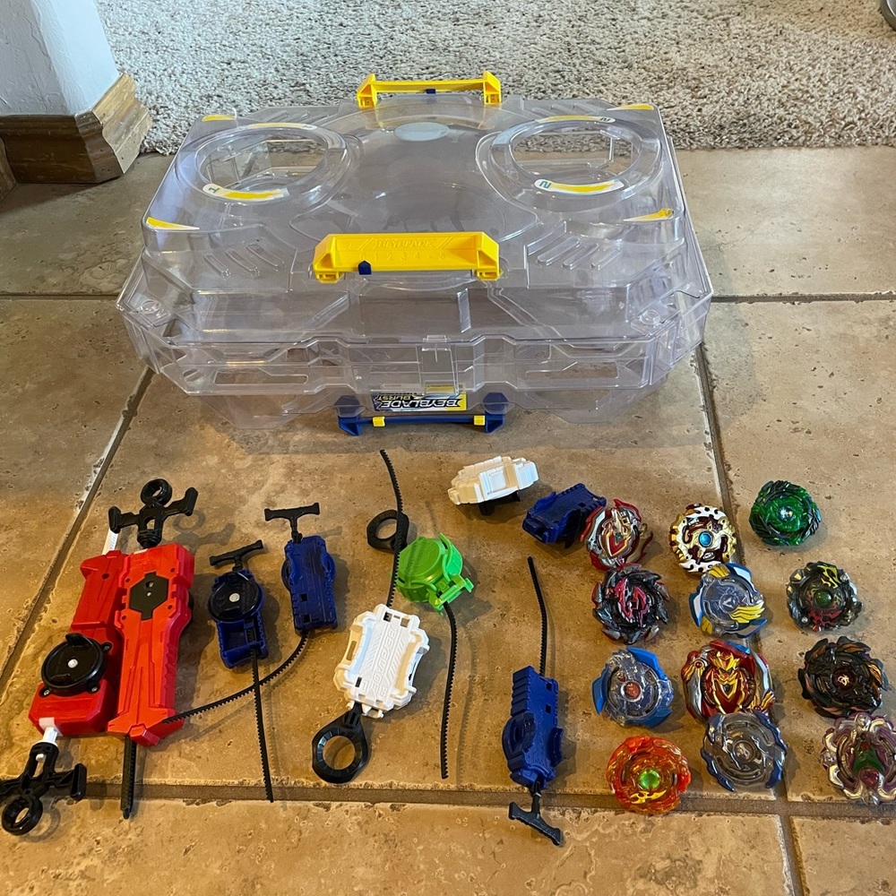 BeyBlades - 12 blades, 7 launchers and one fighting cage